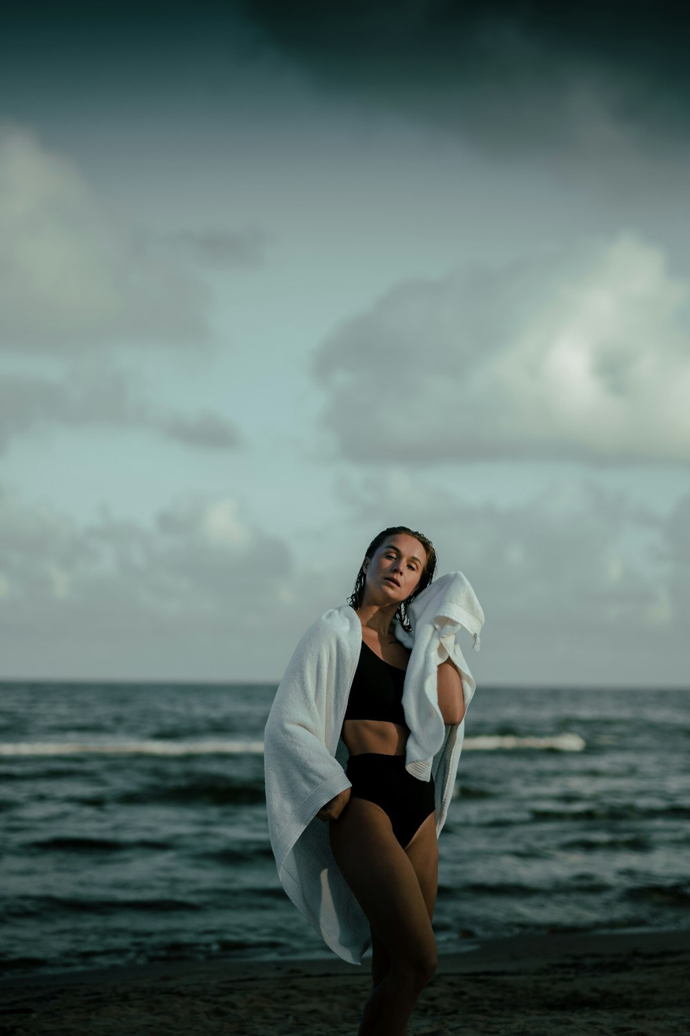 woman standing on seashore during day