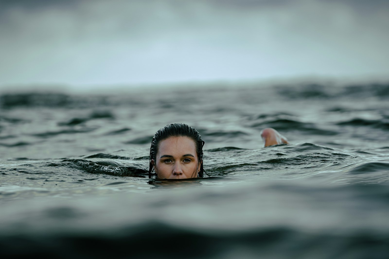 Sony a7 III + Sony FE 70-200mm F2.8 GM OSS sample photo. Woman dipping in ocean photography