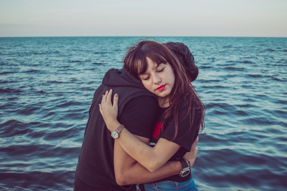 man and woman hugging