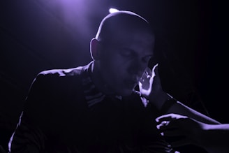 Patient undergoing gentle GFC therapy session with focused laser light on scalp.