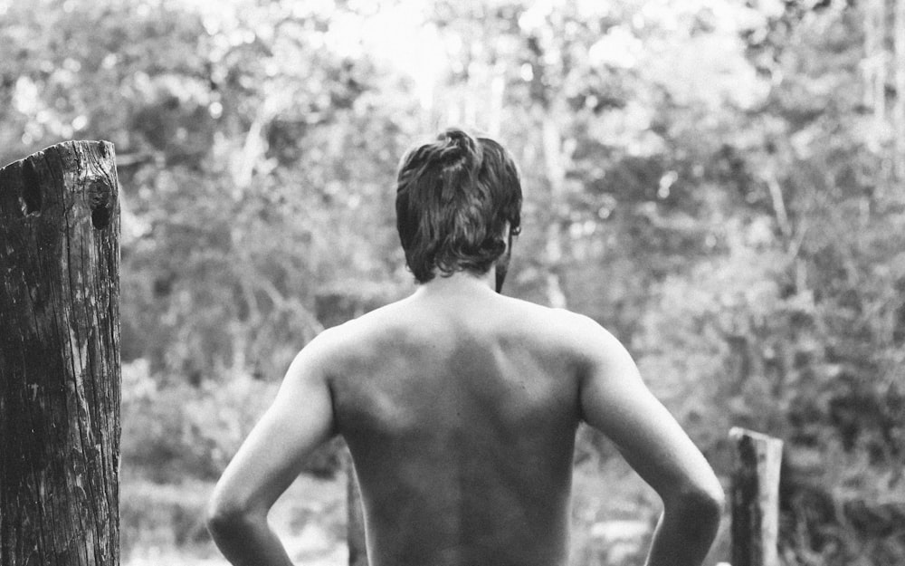 grayscale photography of topless man
