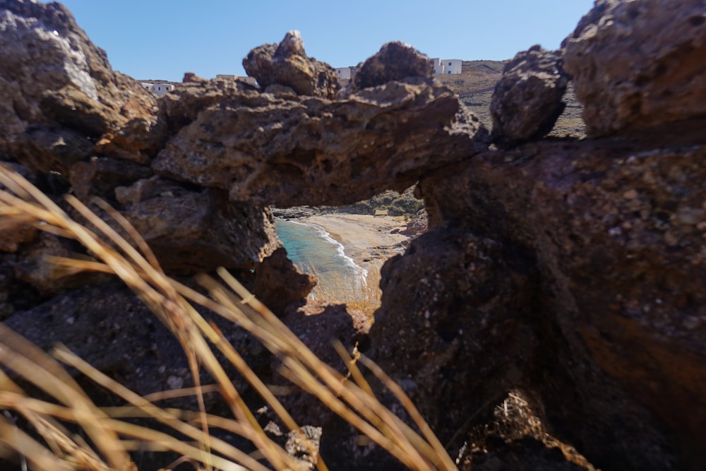 view of a white sand beach from a rock formation