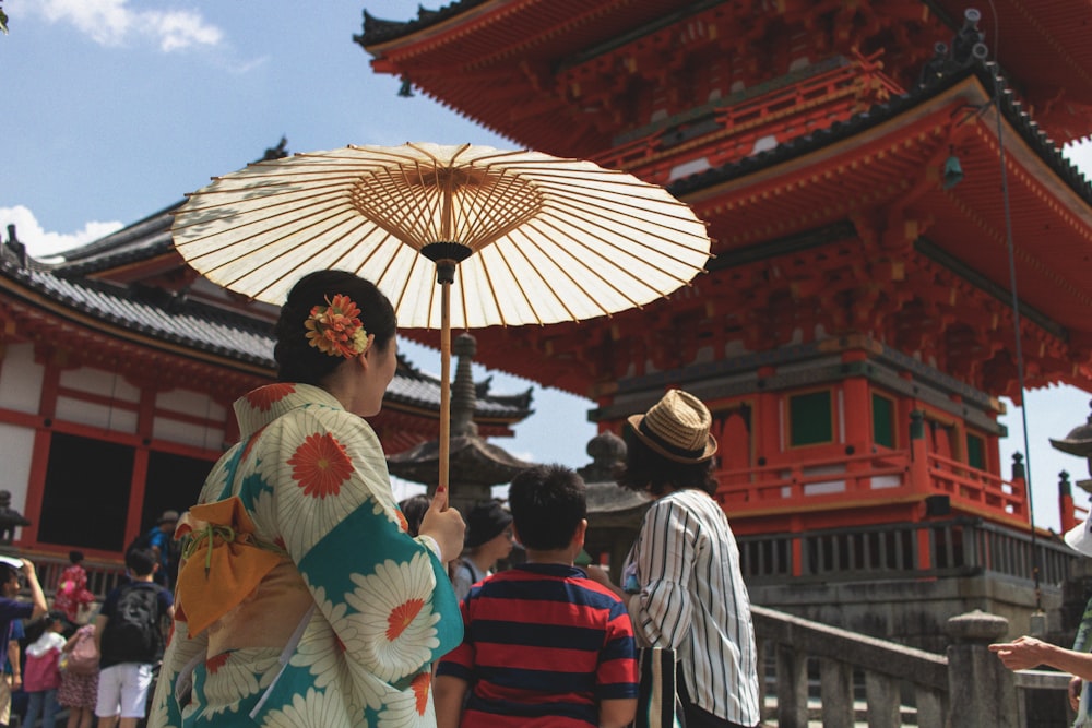 woman holding umbrella during daytime