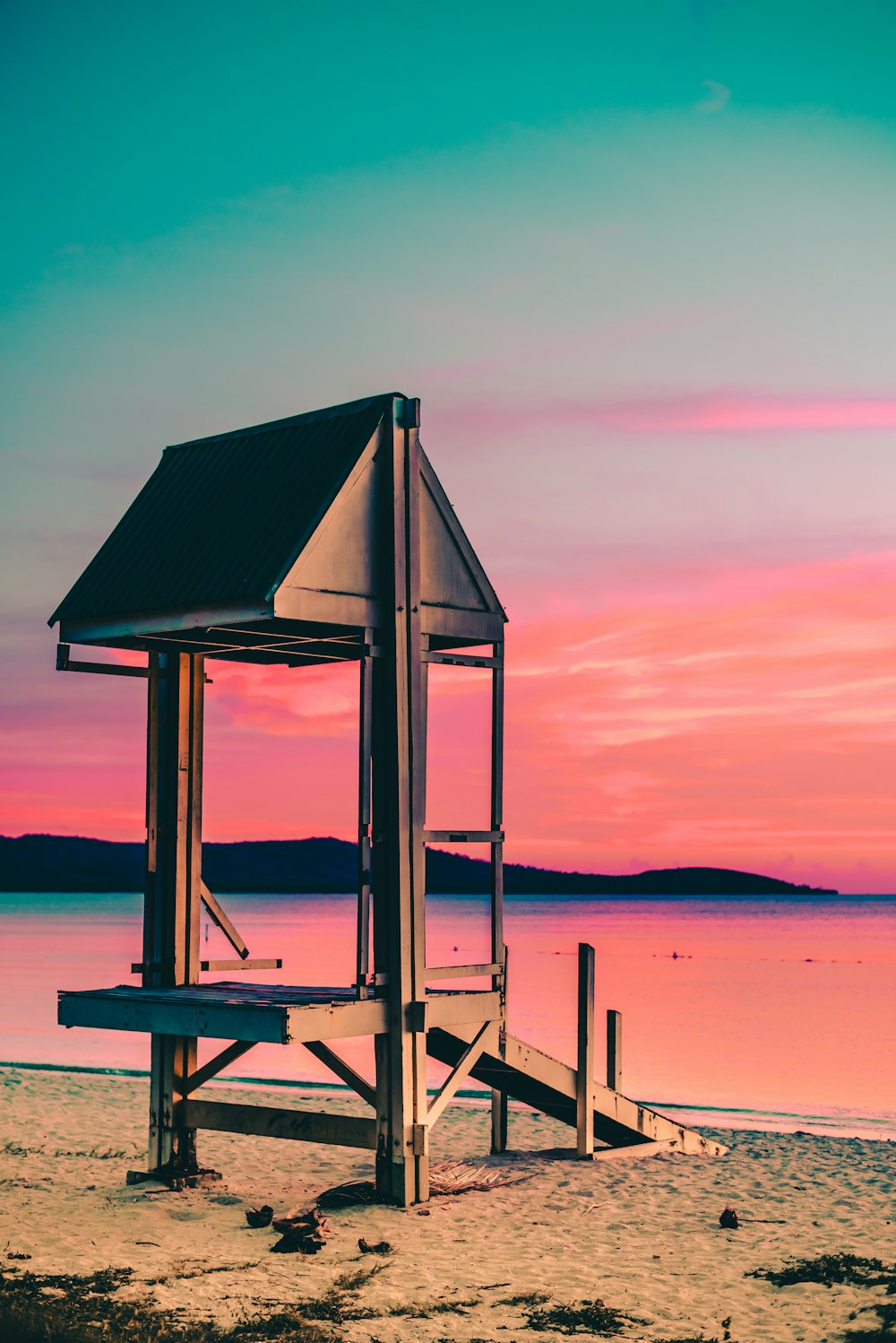 lifeguard house by the seashore during golden hour