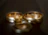Close-up of a delicate gold wedding ring sparkling under soft light.