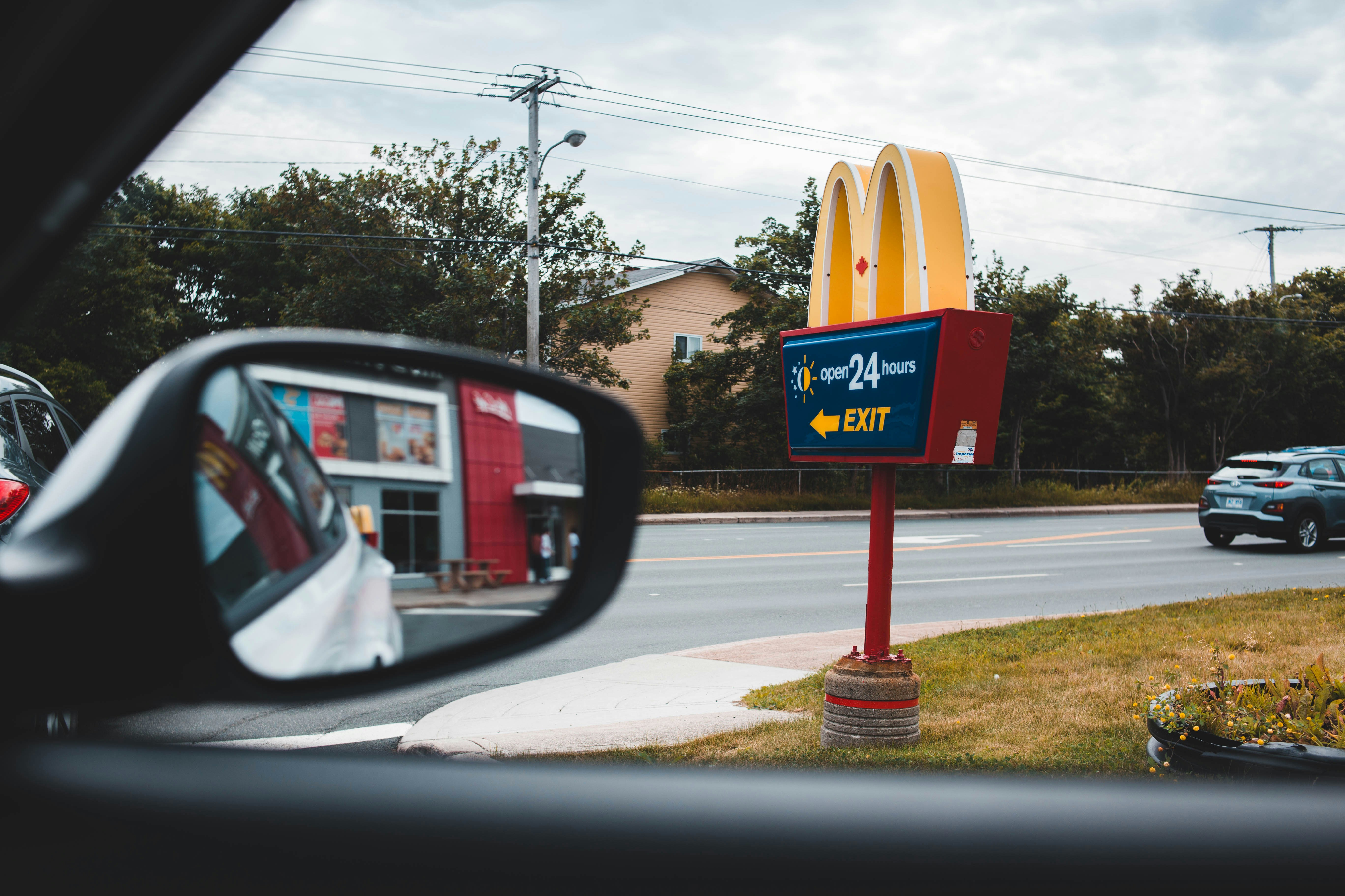 car near McDonald's signage