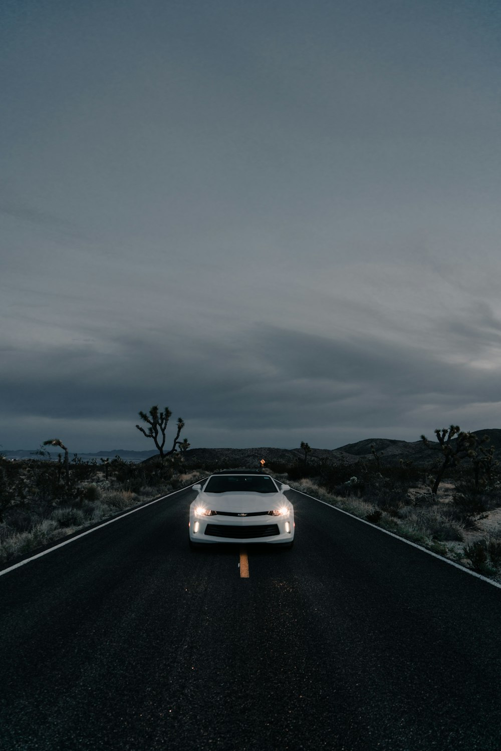 white car on road during nighttime