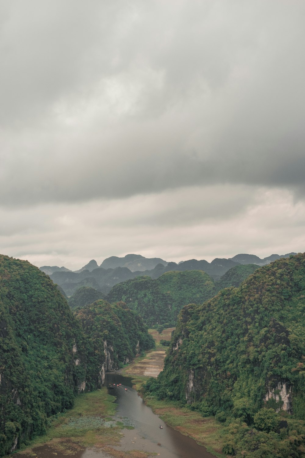 mountains under cloudy sky during daytime