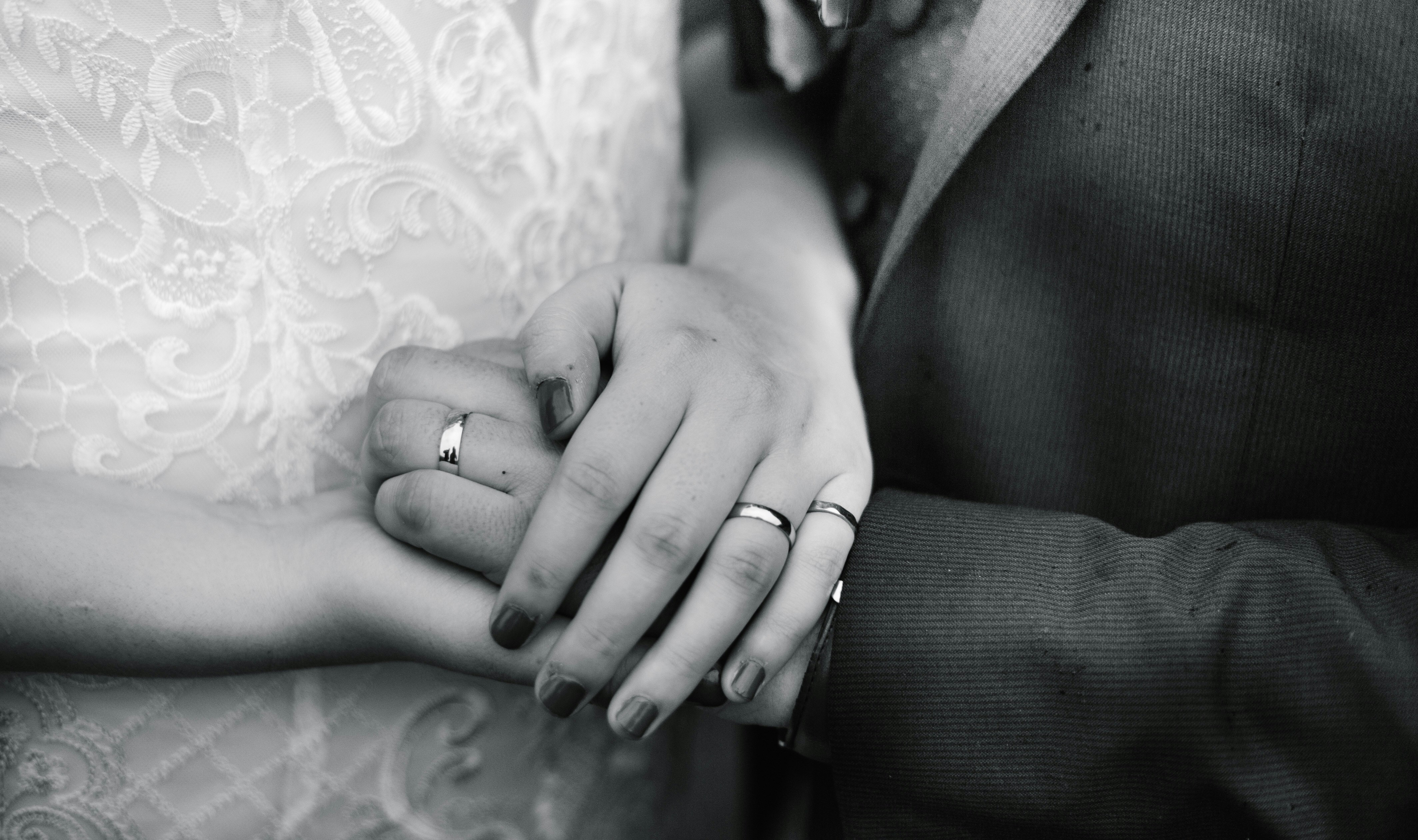 a close up of a person holding a person's hand