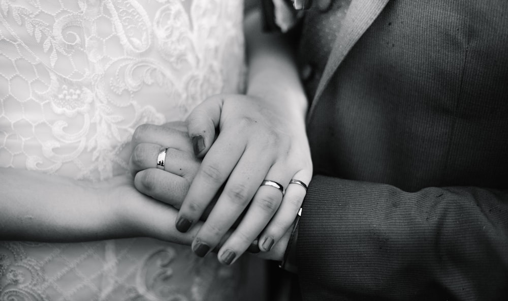 a close up of a person holding a person's hand