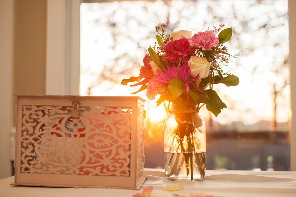 pink and white flowers on vase