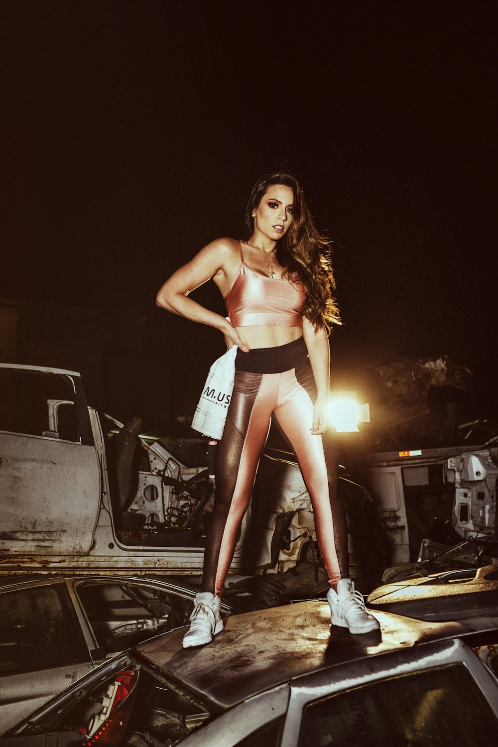 woman standing on vehicle at nighttime