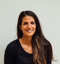 woman wearing black scoop-neck long-sleeved shirt