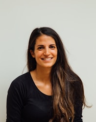 woman wearing black scoop-neck long-sleeved shirt