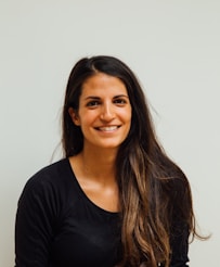 woman wearing black scoop-neck long-sleeved shirt