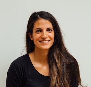 woman wearing black scoop-neck long-sleeved shirt