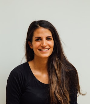 woman wearing black scoop-neck long-sleeved shirt