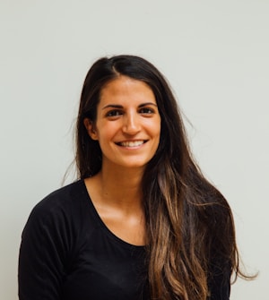 woman wearing black scoop-neck long-sleeved shirt