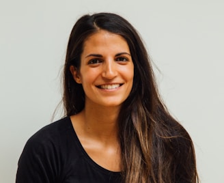 woman wearing black scoop-neck long-sleeved shirt