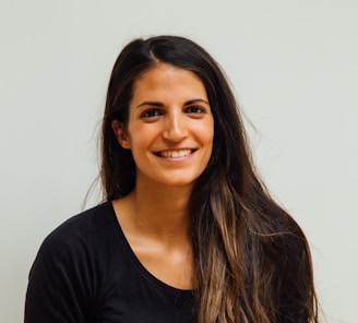 woman wearing black scoop-neck long-sleeved shirt