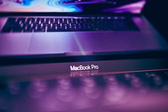 Close-up of a vibrant brand logo design on a laptop screen.