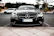 A sleek black Mercedes parked outside Emmanuel Enterprise showroom in Douala.