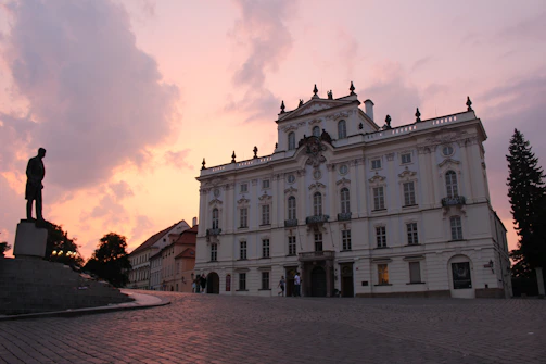 Elegant castle-inspired office building facade at sunset.