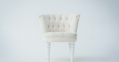 tufted beige sofa chair