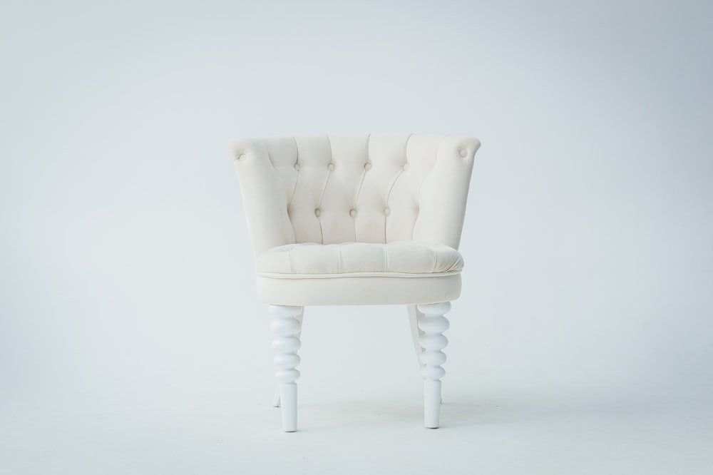 tufted beige sofa chair
