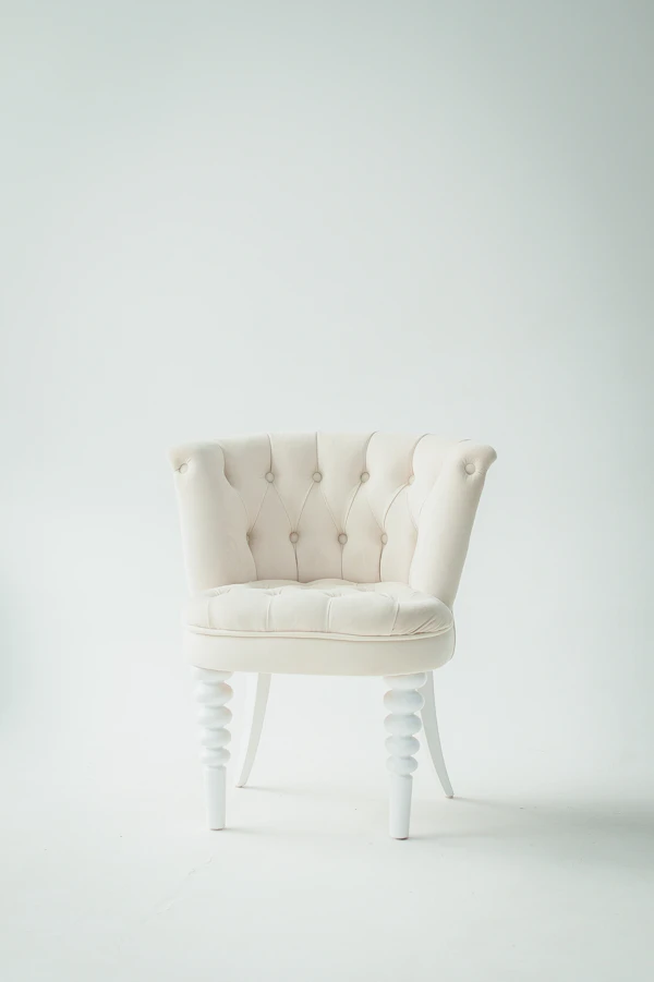 Beige armchair with wooden legs