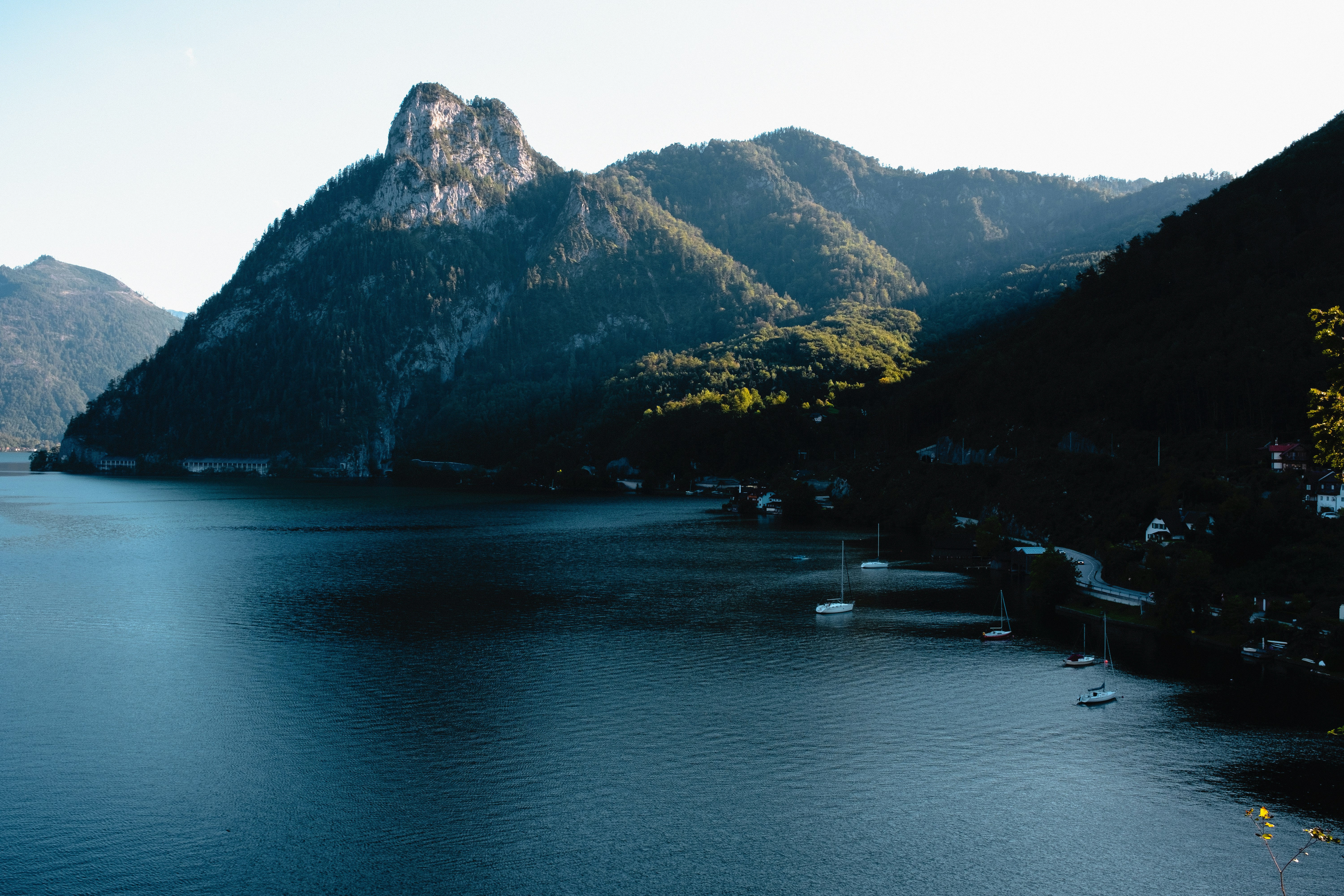 calm sea beside mountain range