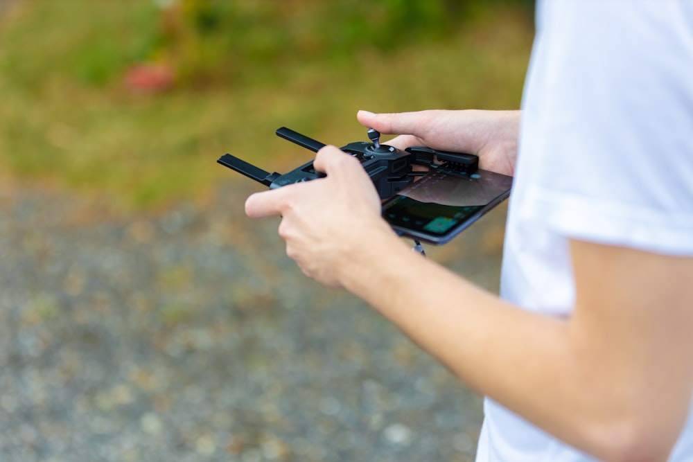 person holds game controller