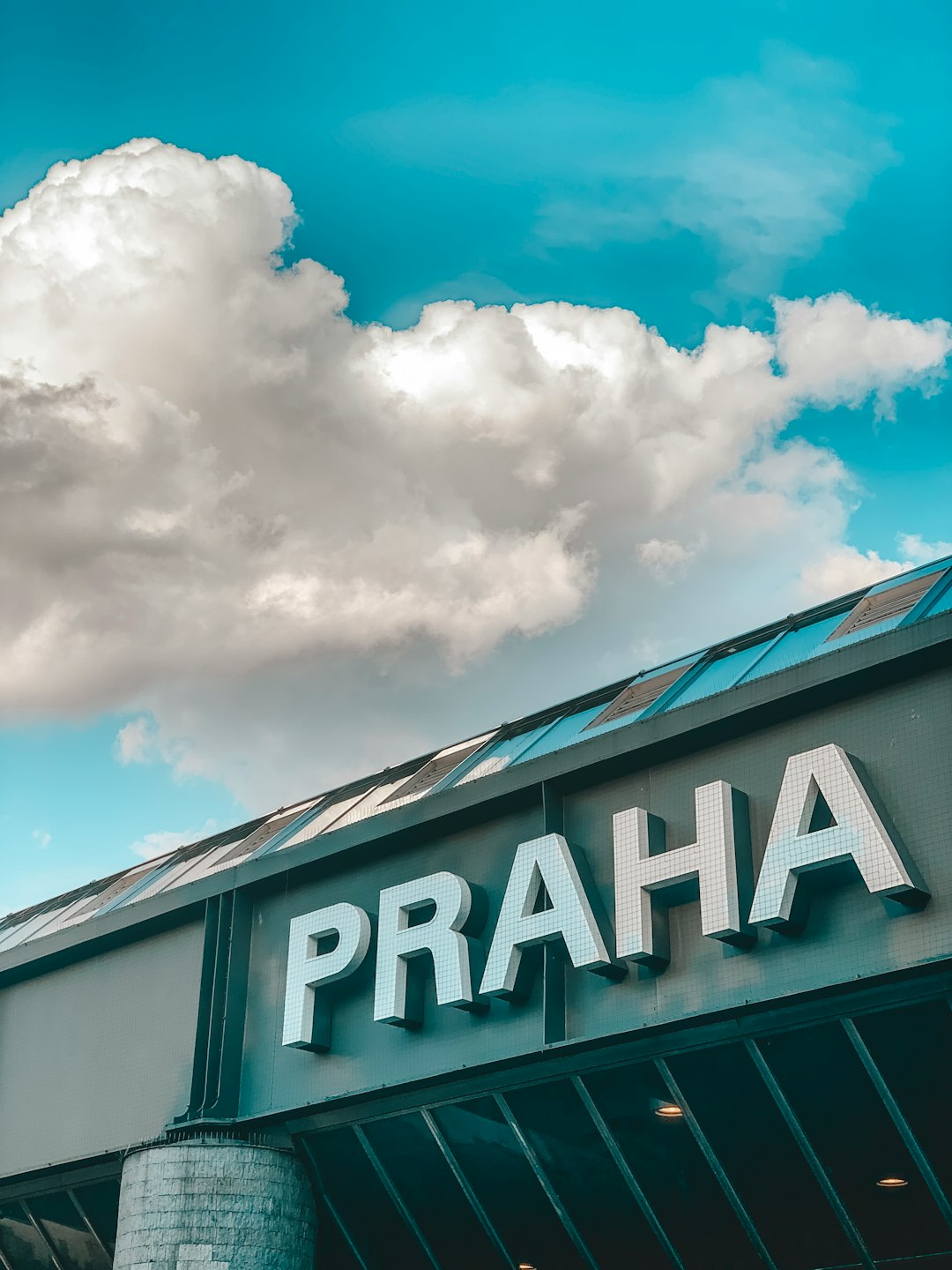 Praha storefront under clear blue sky