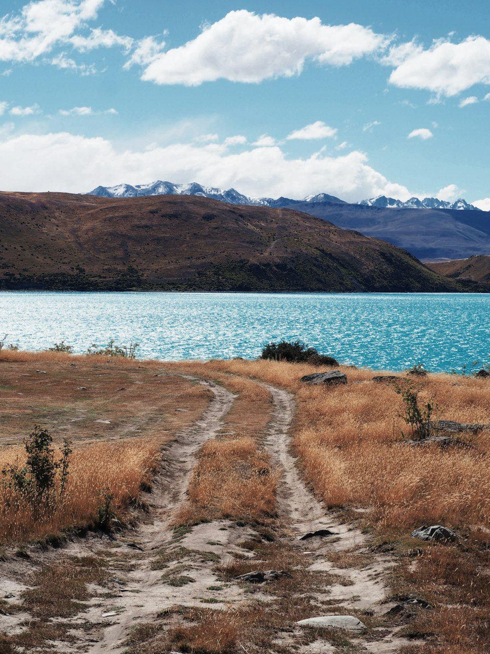 blue body of water under white clouds