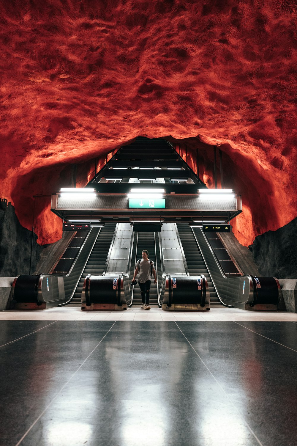 woman standing near escalator