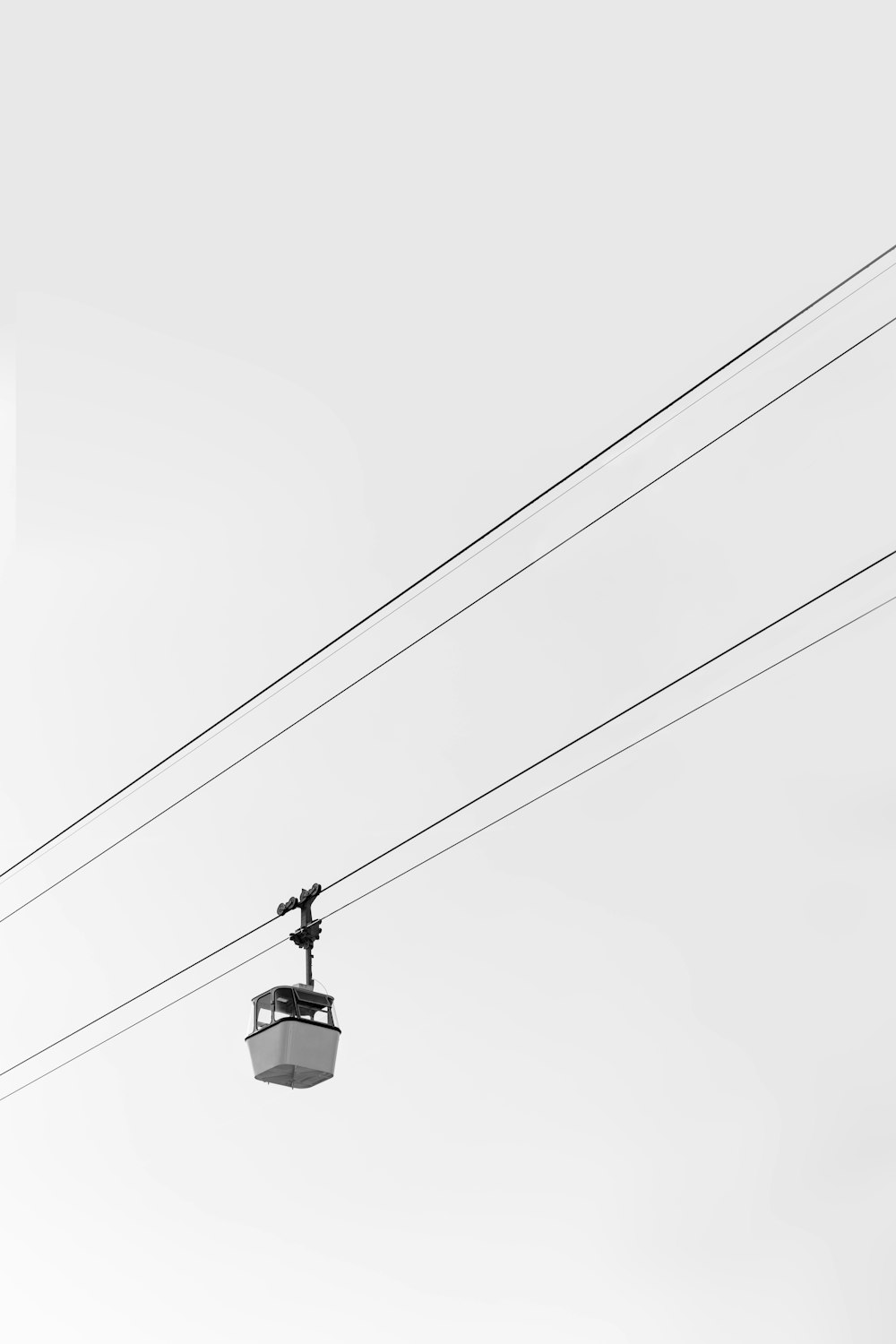 white cable car under white sky