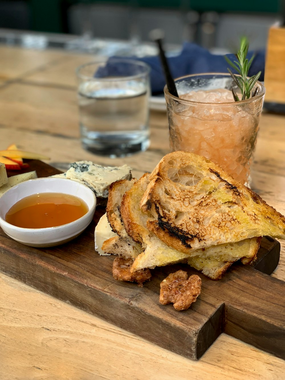 egg omelet on top sandwich beside cocktail drink