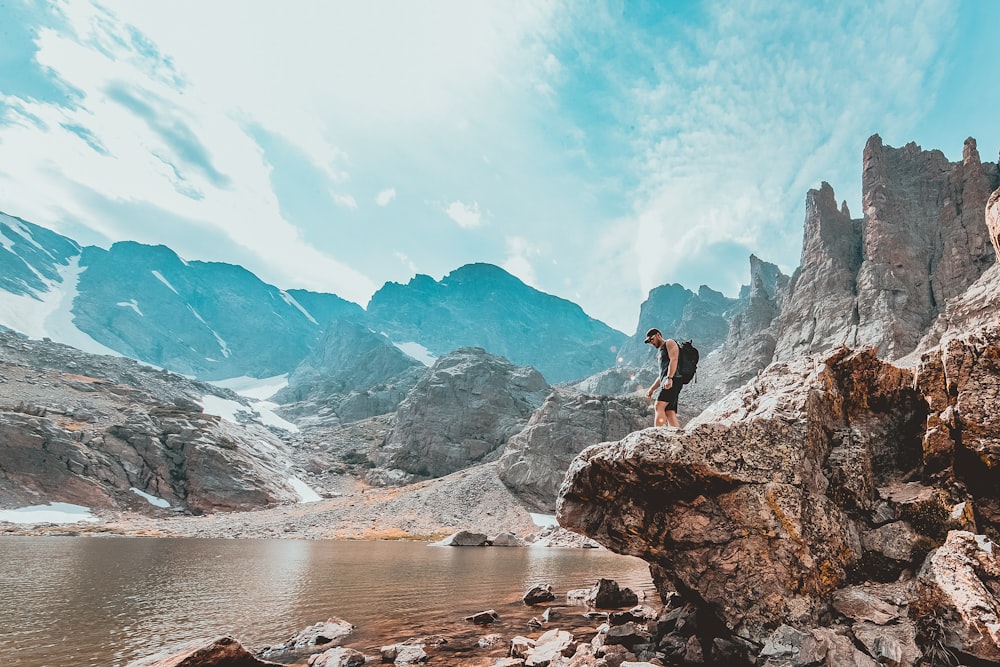 person standing on rock