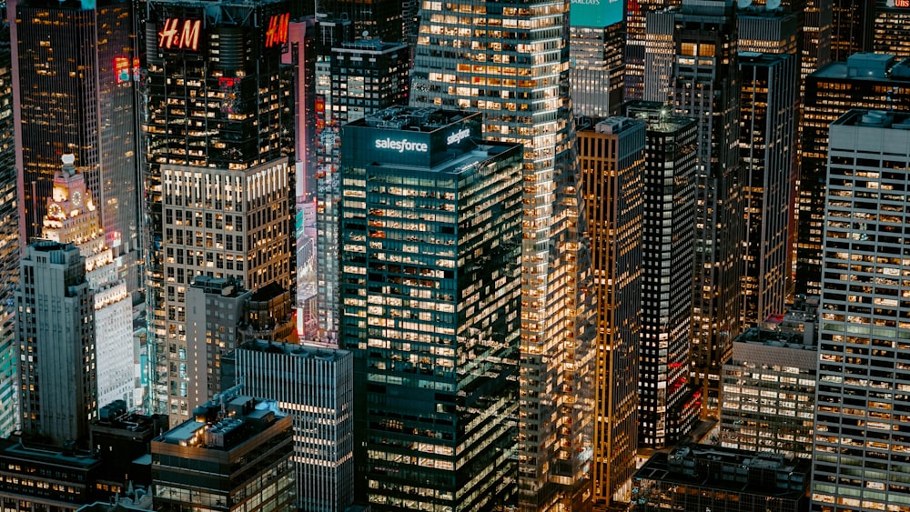 a view of a city at night from the top of a skyscraper