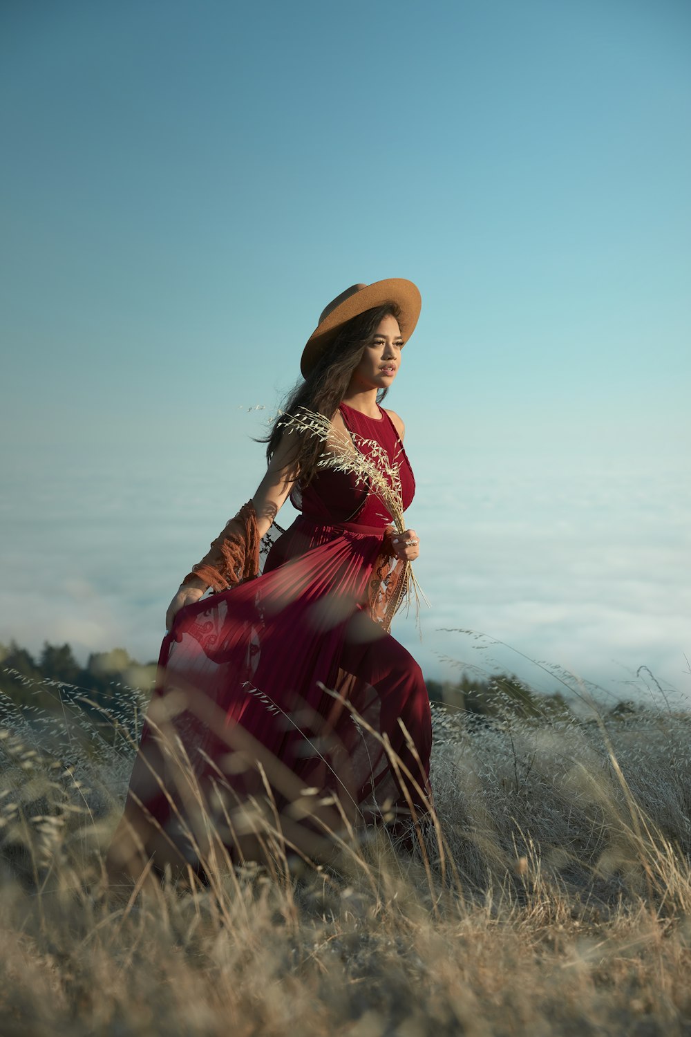 woman wears red long-sleeved dress