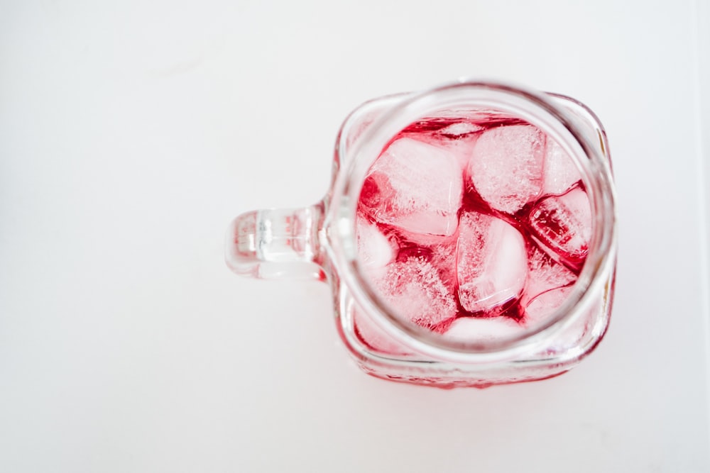 clear glass mug with beverage