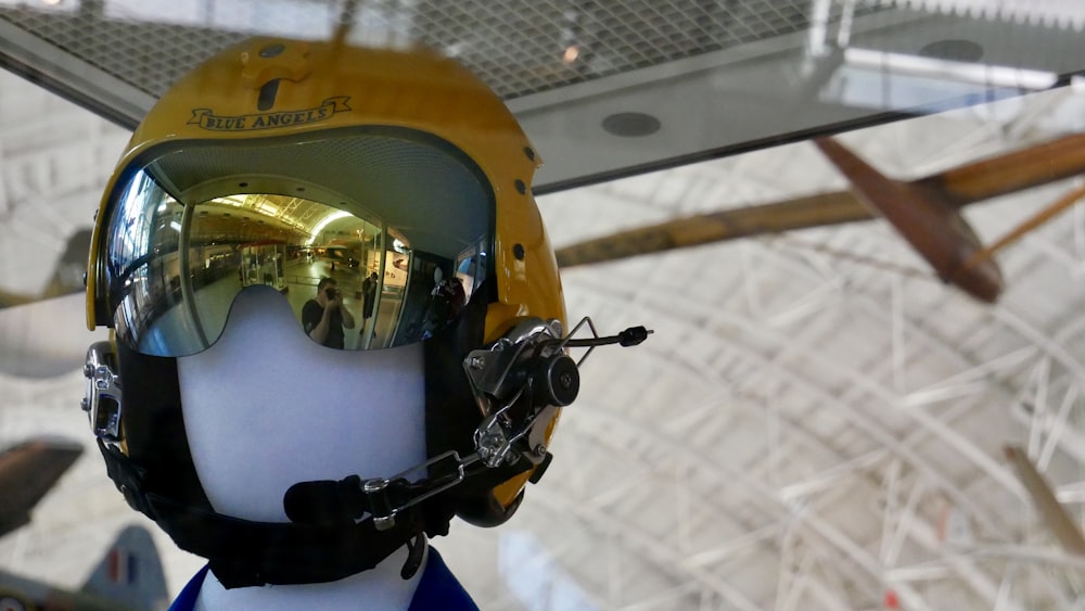 a helmet and goggles on display in a museum