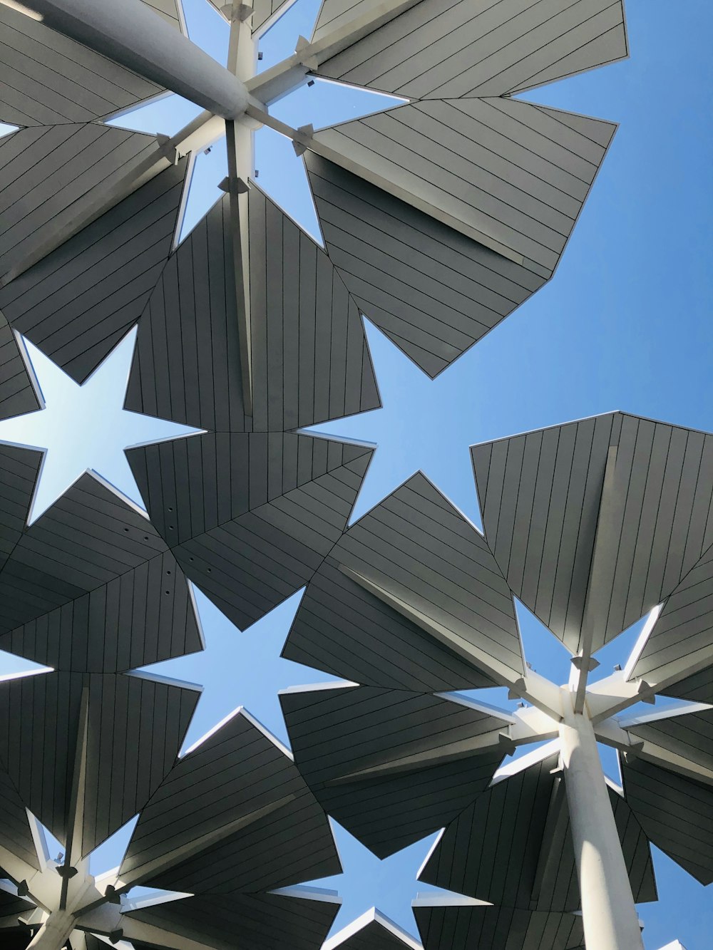 gray metal roof under blue skies