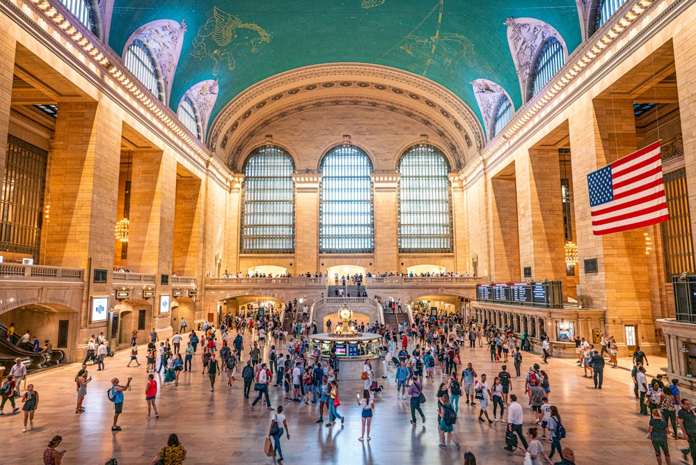 crowd of people walking in Grand Central Terminal