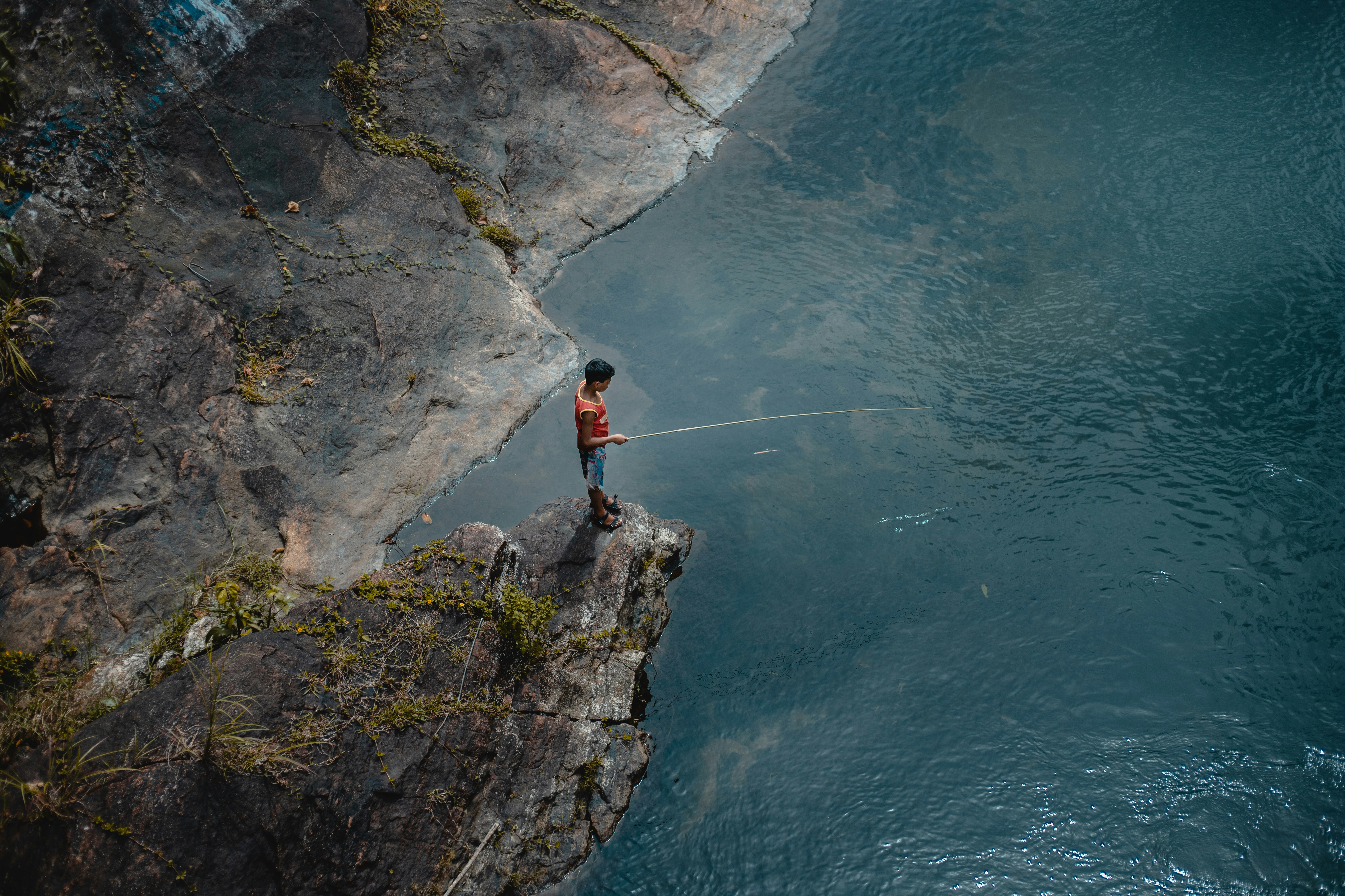 Person fishes on water photo – Free Wallpaper Image on Unsplash