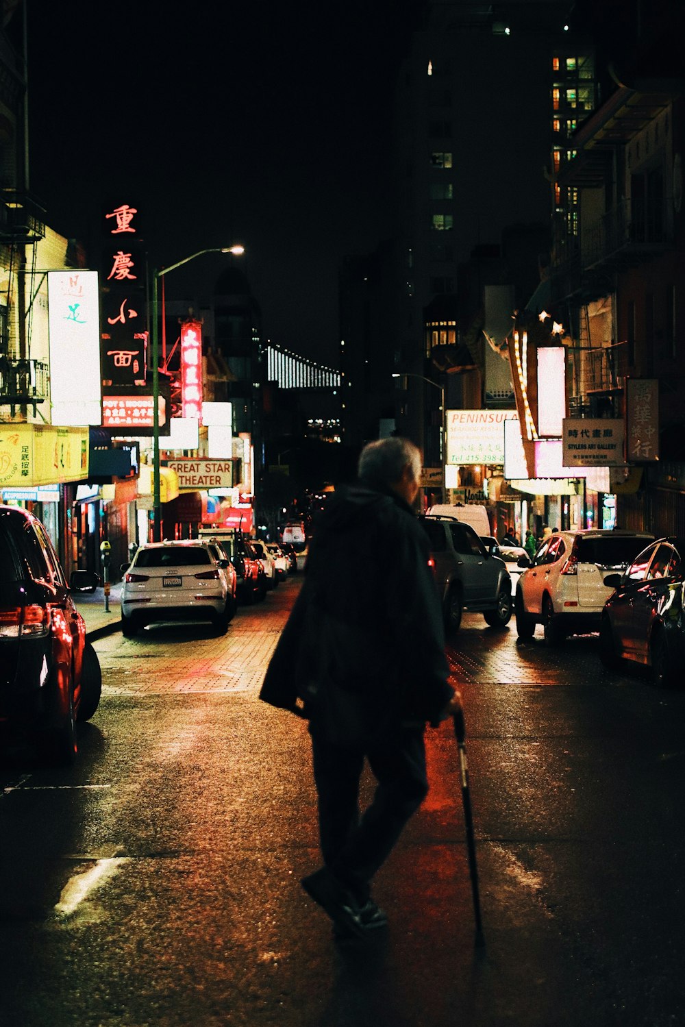 man standing near vehicles