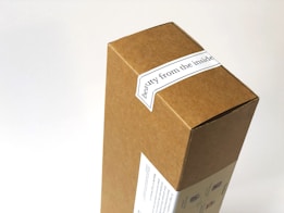 A cardboard box with a label that reads 'beauty from the inside'. The box features simple printed graphics on one side, over a white background.