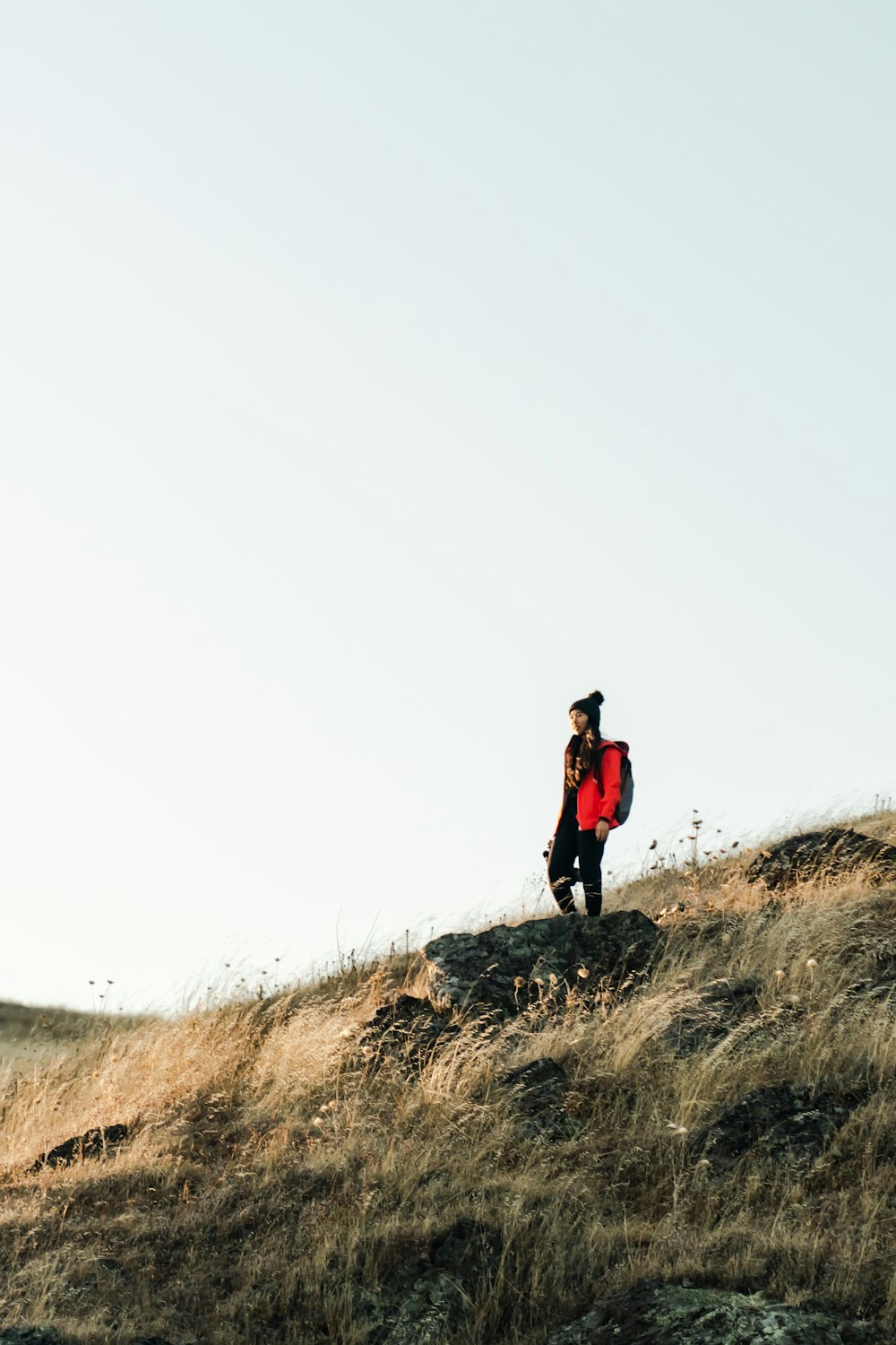 person standing on hill