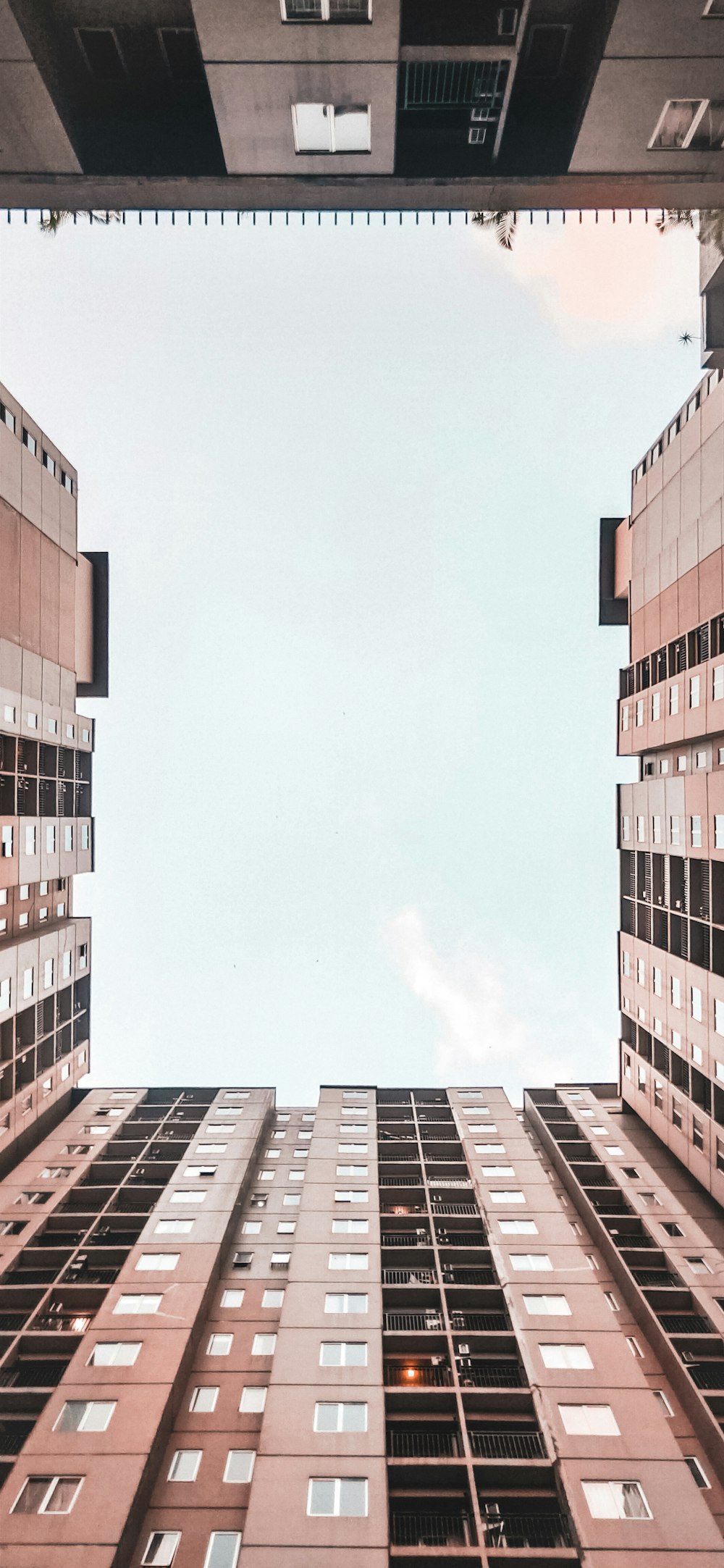 low-angle photography of brown high-rise buildings