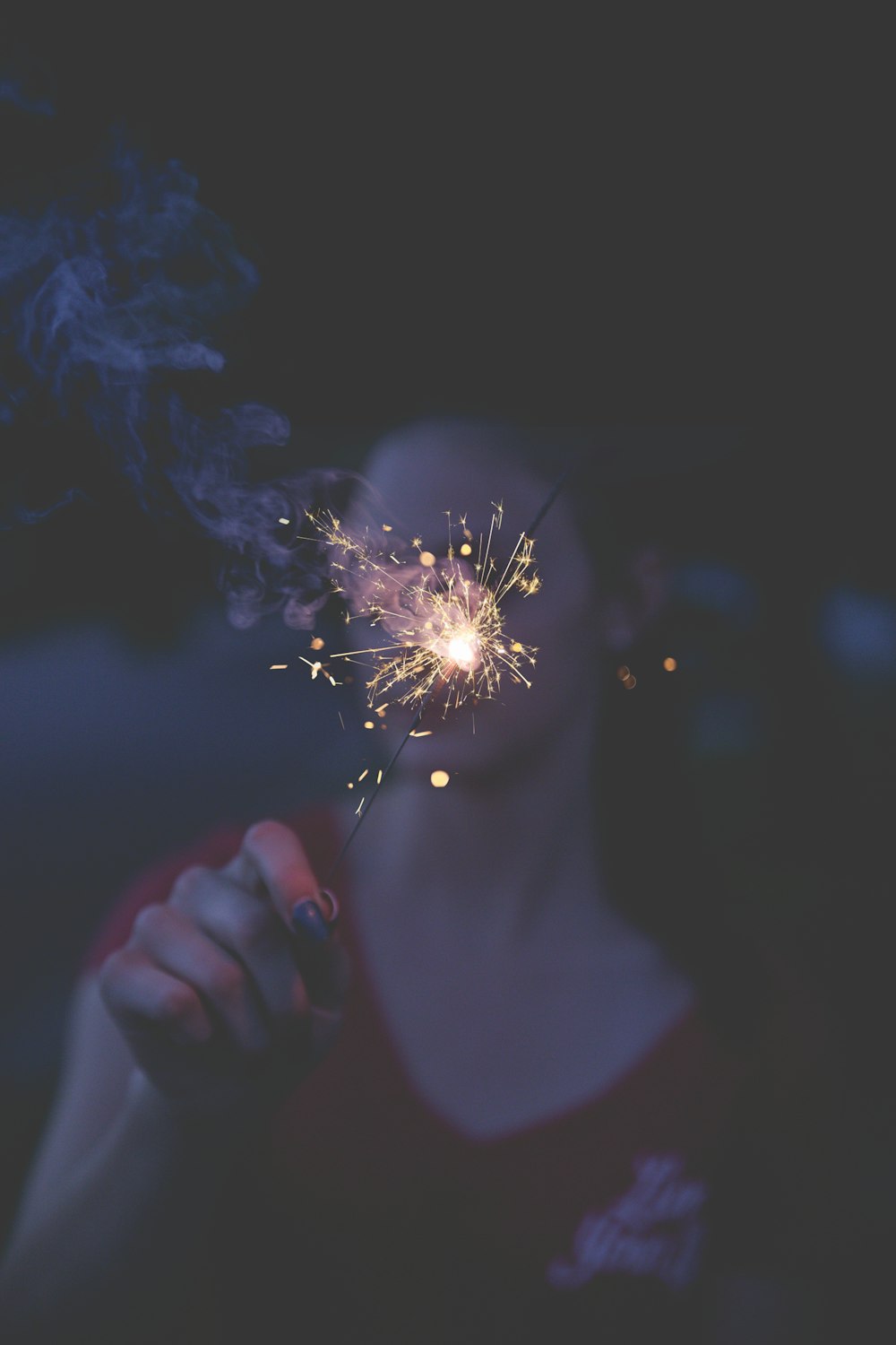 woman holding sparkler